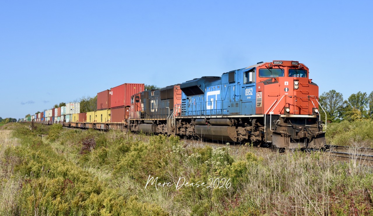 Train 148 rolled into Sarnia, ON., with the GT heritage unit leading and tied down for about an hour before continuing east on the Strathroy Sub on a beautiful early fall morning.
