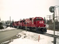 Went out for the ethanol train on a decently mild early March day and was treated with a trio of CP SD60s for power. A nice change from the usual mixture of 'anything that runs'.  This image was taken at Township Rd 6; south end of the community of Innerkip and the power is CP 6230, 6236 and 6249.
The paint looks clean; the units had recently been part of the SOO empire, now lettered for CP.