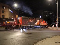 Solo CN 7075 chugs away with its train of tanks heading towards Elmira for switching out Lanxess up there. Note, WCR does switching in/around the plant and CN will do a lift/setoff and maybe other switching. Here it is pictured crossing the intersection of Erb St. and Caroline St. in Uptown Waterloo.
