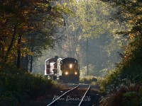 A beautiful cool and crisp fall morning with a little bit of fog caught my attention as I crossed the tracks at Benson Street in Ingersoll. The fast rising sun was not in my favour as the fog was burins off fast. After a short wait the St. Thomas job showed up with OSR 102 leading and 1244 trailing, still an interesting photo I think.