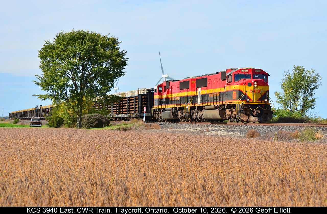 CPKC ran an eastbound welded rail train out of Chicago bound for Montreal October 10, 2026.  Power was a pair of SD70MACs, KCS 3940 & 3961, and as luck would have it they were slow getting to Windsor.  With a mammoth #529 train (196 cars), also on the line, the two trains met in Belle River which gave me some extra time to setup for a shot of the KCS 3940 East.  Here the CWR train rolls along the CPKC Windsor Sub between St. Joachim and Haycroft after having already met CPKC #529 in Belle River.