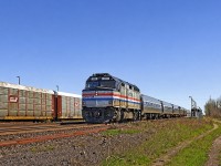 Amtrak F40PH #265, operating as VIA train #97 (The Maple Leaf), departs Aldershot for Niagara Falls and ultimately NYC. It's amazing to look back and see how small and seemingly insignificant Aldershot station was back then compared to today- the scene almost looks forlorn despite the autoracks in the yard.