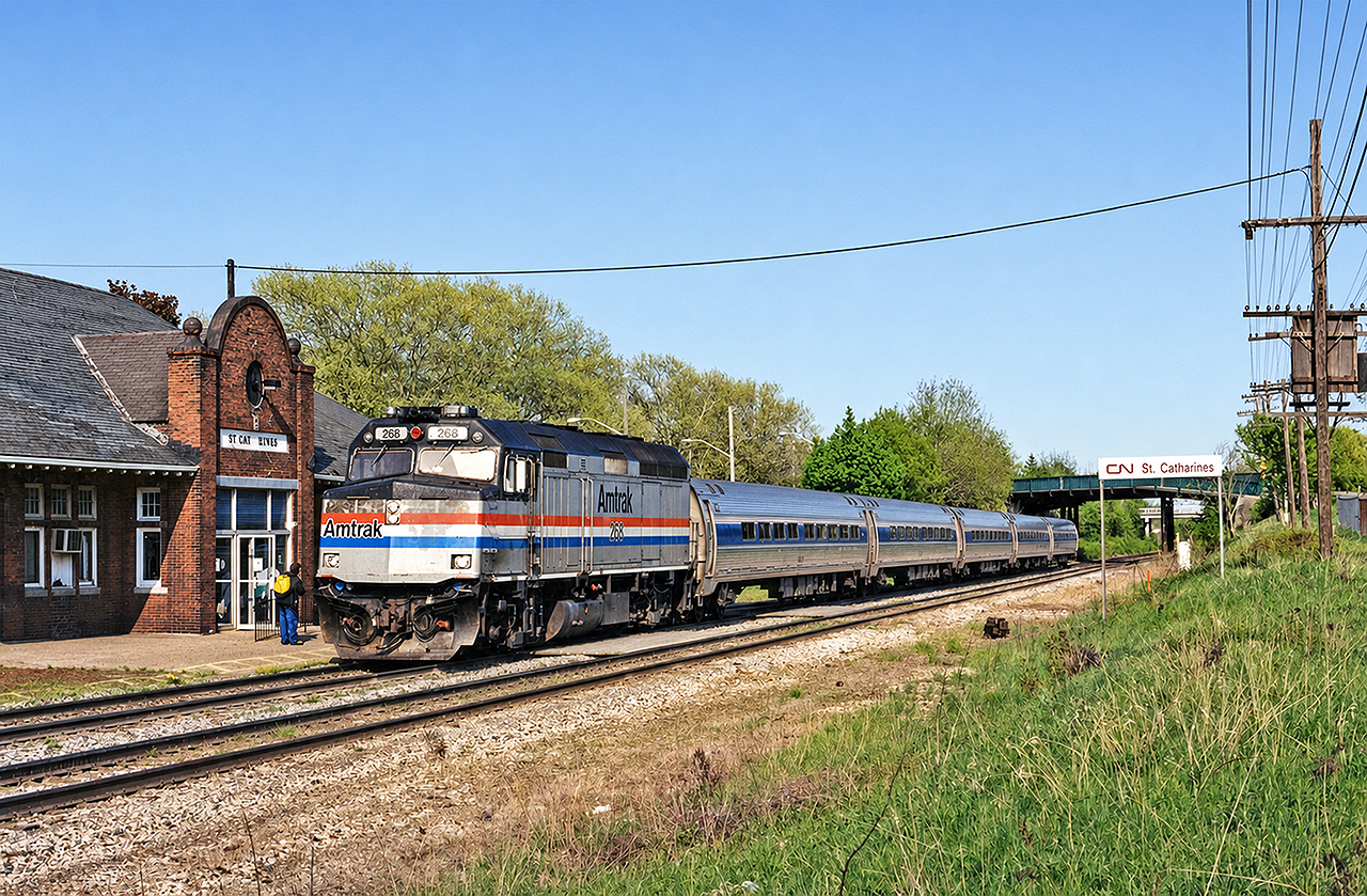 Amtrak F40PH #268 brings VIA train #98, the Maple Leaf, to a stop in St. Catharines nearing the final miles of its journey from NYC (well, Albany for the locomotive) and its own final miles with Amtrak. P42s were soon to take over. The Maple Leaf was one of the last holdouts for the Amtrak F40s, as VIA crews were not yet accustomed to P32/42 locomotives. Once VIA retired their LRCs and crews became familiar with the P42, Amtrak began deploying their own on this and the Adirondack train. The venerable Amtrak F40s were relegated to the dust bin of history.