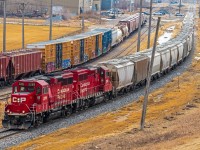 Looking down from Winnipeg's garbage hill, watching a CPKC train roll by heading back to their yard.