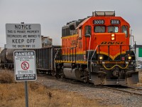 BNSF 3008 leading their small little freight train through Winnipeg's St. James neighborhood. They will leaving cars for CPKC to pick up.