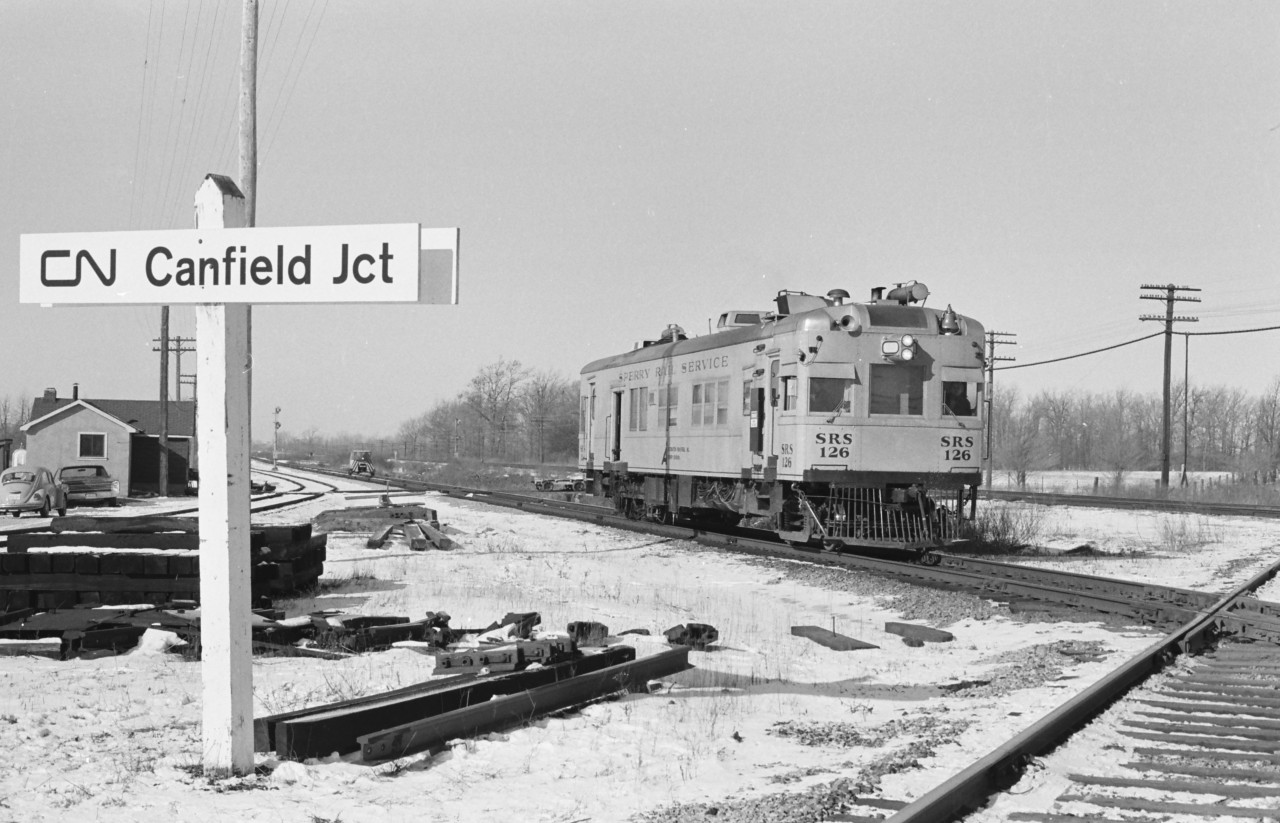 With an accompanying motor car patrol, Sperry rail detector car 126 is working eastbound this day on CN's Cayuga Subdivision, keeping CN and Norfolk & Western moves safe. And as we see, the Track department is pretty well prepared for any replacement and repairs.
With over 275 visits, day and night, to this location, it was my favorite for Train Time is Any Time.
However, it is these days now an empty field, returned to nature.
ETTS