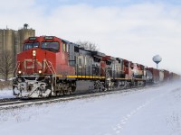 The namesake town, of the namesake subdivision. On a cold wintry day, nearing the end of 2017...I look back and wonder why CN didn't lead with the BC Rail (BCOL?) 4643. Oh well. Still a good catch, as the train heads west to Sarnia, passing Strathroy's water tower along with the former silos that once received cars. 