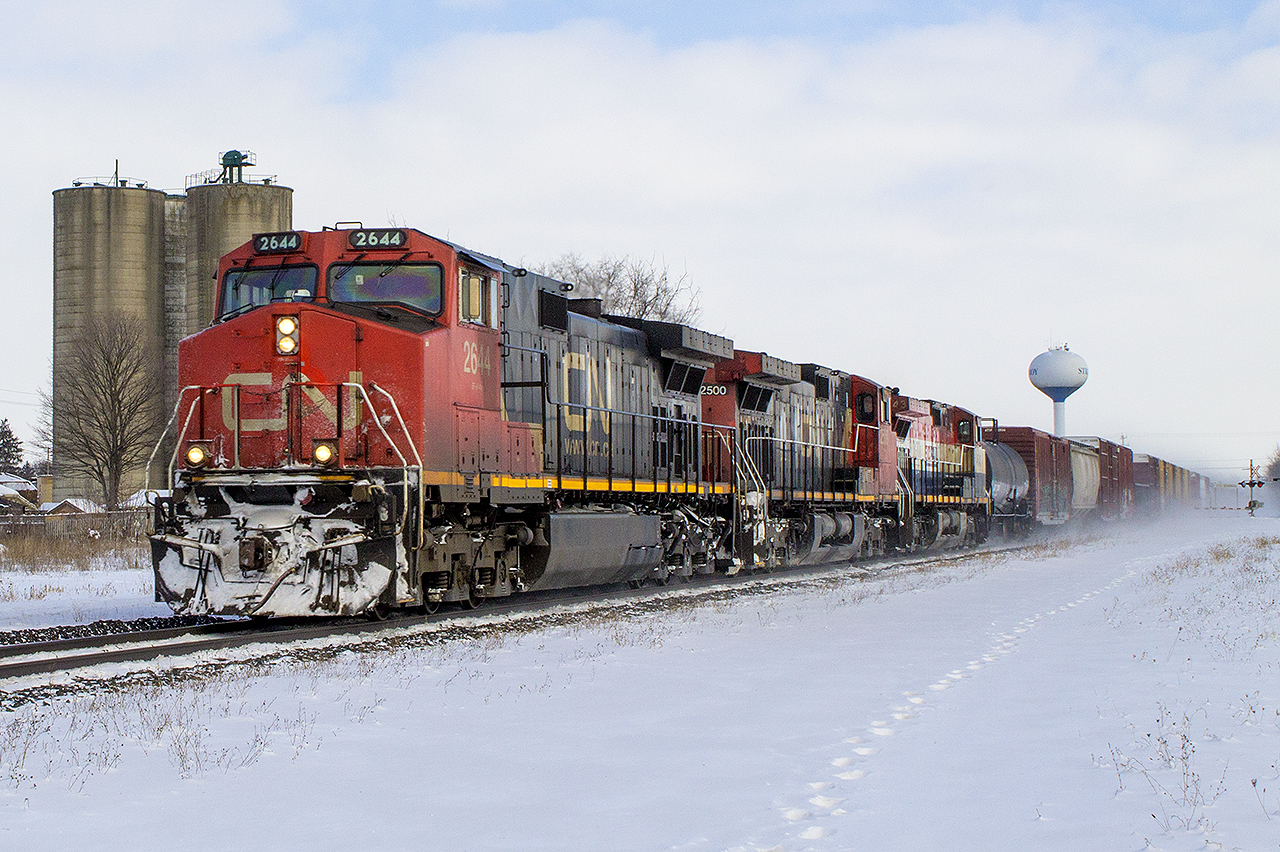 The namesake town, of the namesake subdivision. On a cold wintry day, nearing the end of 2017...I look back and wonder why CN didn't lead with the BC Rail (BCOL?) 4643. Oh well. Still a good catch, as the train heads west to Sarnia, passing Strathroy's water tower along with the former silos that once received cars.