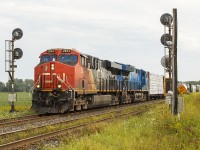 After seeing the Anniversary train along Sarnia's waterfront,  I was out and about. To end the day, I shot this train when it came to a stop, <a href="http://www.railpictures.ca/?attachment_id=34577"> at Camlachie Road for clearance into Sarnia. </a> Thankfully, the rain had stopped and the sun hadn't fully come out again as the train is now entering Sarnia at Blackwell Road. 
<br>
<br>
As it splits the signals,  of note are the two signs on either side showing what appear to be radio frequencies to communicate through.