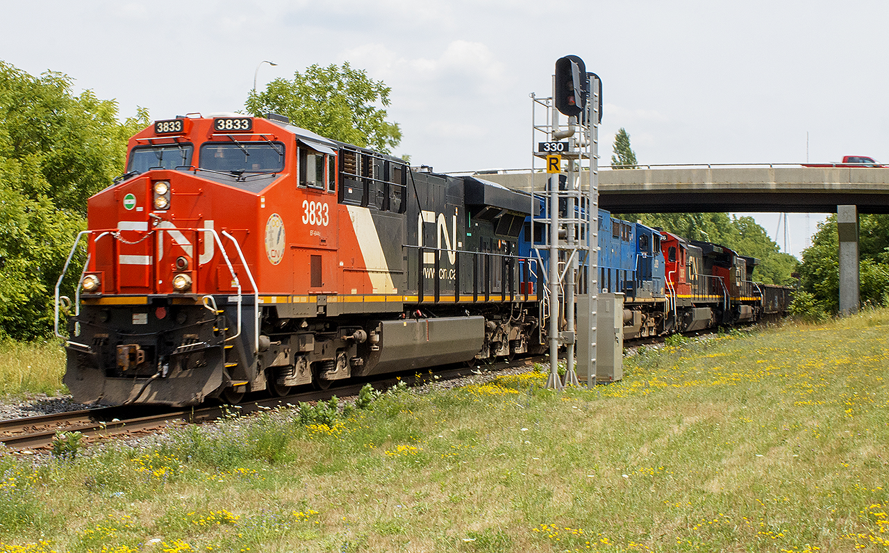 Nice summer day, for another trip out during the pandemic. Searching along the Strathroy Sub., I had first missed this train at Strathroy, got ahead of it at  Kerwood (due to a meet) , then picked Watford due to the openness of the old  station grounds.  


What interested me, was not only 4 engines including what I assume at the time was a blue CEFX leaser, but CN 2036. A C40-8, it really stood out against this mix of power and reminded me of older power that once traversed CN's network. 


Glad I snapped this photo when I did. After researching more information about 2036, it was retired in 2023. I can only imagine it was scrapped.
