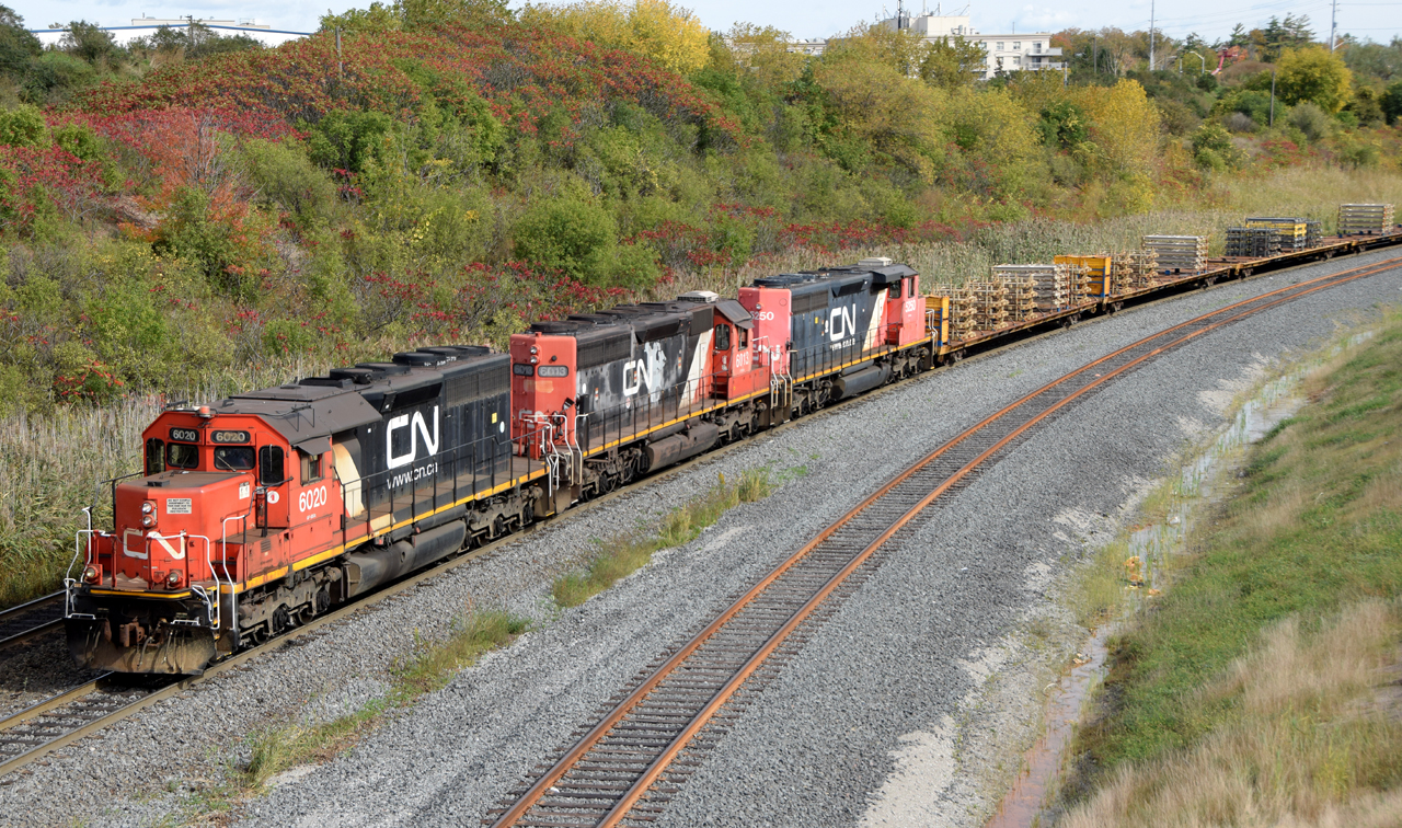 CN 6020, CN 6013, and CN 5250 working hard to shove another cut of cars across the hump at Mac Yard