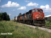 CN train 431 is pictured departing Kitchener, Ontario on the Guelph Subdivision for Stratford having just crossed Park and Strange Streets. Powering the train is GP40-2L(W) 9617 as well as M-420(W)’s 3531 and 3519. 