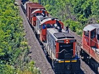 CN SW1200RS #1362 leads another sister with a short transfer train (including a van!) through Bayview Junction on a hot early afternoon in August 1997. SD75I 5656 can be seen heading a manifest train towards the Dundas Subdivision. The 1362 has long since left CN's roster, and the 5656 has been rebuilt into SD75IACC 8321. I always liked the SW1200s and didn't think they'd be gone as soon as they were, especially given how long the GP9RMs have soldiered on. The lighting here wasn't ideal which I knew at the time, as I was there to capture VIA train 73 from the other side of the bridge. This short train happened to appear, so I took what I got as a bonus regardless of the lighting. More examples of power I wish I'd have chased down and photographed now.