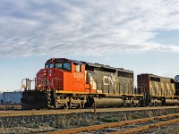 CN SD40-2W #5320 leads SD40 #5223 on a train full of autoracks from the Oakville Ford plant westbound through Burlington on a calm April morning. I believe the 5320 is still active on CN's roster, but the classic SD40 5223 has long been scrapped and met its end at Larry's Truck and Electric. 