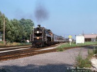 Operating on an excursion run enroute from Niagara Falls to Toronto, Canadian National 4-8-2 "Bullet Nosed Beatty" 6060 negotiates the crossovers at the CN Hamilton interlocking, coming off the Grimsby Sub and onto the Oakville Sub on the approach to the CN station at James Street, and passing the switch where CN's Hagersville Sub branches off to the right for Ferguson Avenue.
<br><br>
<i>Bill McArthur photo, Dan Dell'Unto collection slide.</i>