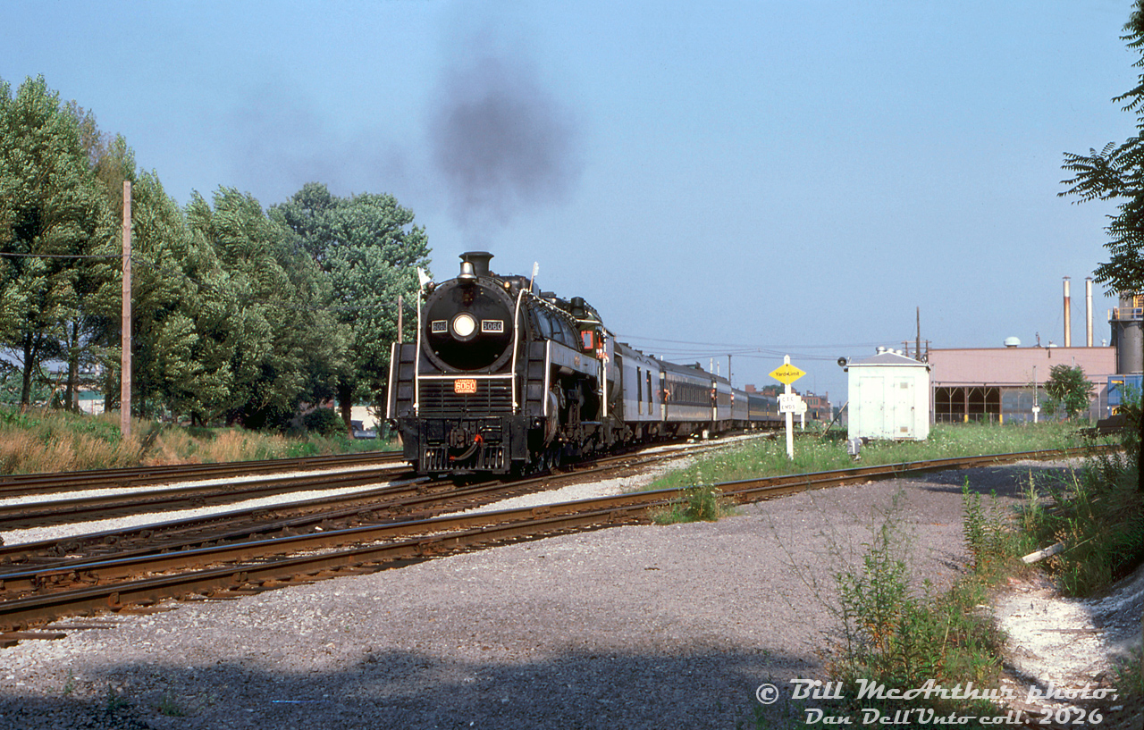 Operating on an excursion run enroute from Niagara Falls to Toronto, Canadian National 4-8-2 "Bullet Nosed Beatty" 6060 negotiates the crossovers at the CN Hamilton interlocking, coming off the Grimsby Sub and onto the Oakville Sub on the approach to the CN station at James Street, and passing the switch where CN's Hagersville Sub branches off to the right for Ferguson Avenue.

Bill McArthur photo, Dan Dell'Unto collection slide.
