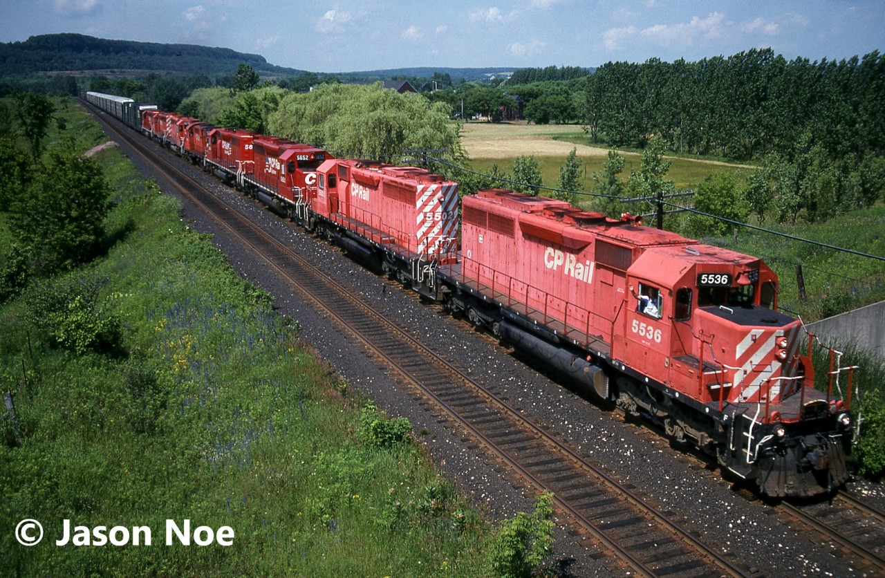 A CP eastbound with eight units is pictured entering Milton, Ontario on the CP Galt Subdivision as it descends the Niagara Escarpment. Led by SD40 5536, the consist included seven SD’s and one RS18u.