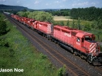 A CP eastbound with eight units is pictured entering Milton, Ontario on the CP Galt Subdivision as it descends the Niagara Escarpment. Led by SD40 5536, the consist included seven SD’s and one RS18u.