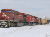 Since I posted a nice wintry photo of a <a href="http://www.railpictures.ca/?attachment_id=60206"> CN train through Strathroy, </a> here's another. This time for the 'then' CP at the John D. Bradley Convention Centre. 
<br>
<br>
To the left of the engines nose, is the old CAW Hall. Still unused, and up for sale. Now you can't even see it, as new housing and apartments block this view. High above the train, to the right is the silo for Dover Corn Products, who once used the CP for transport (their spur is still intact, and includes an abandoned tank car within their property).