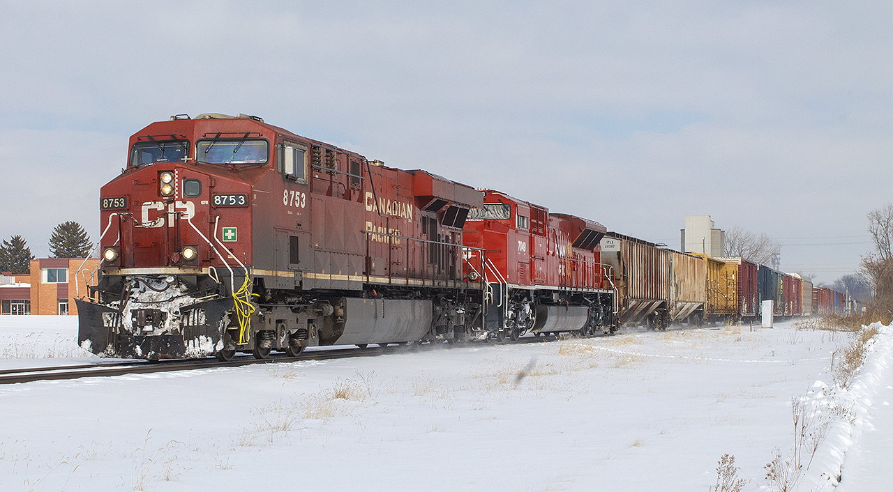 Since I posted a nice wintry photo of a  CN train through Strathroy,  here's another. This time for the 'then' CP at the John D. Bradley Convention Centre. 


To the left of the engines nose, is the old CAW Hall. Still unused, and up for sale. Now you can't even see it, as new housing and apartments block this view. High above the train, to the right is the silo for Dover Corn Products, who once used the CP for transport (their spur is still intact, and includes an abandoned tank car within their property).