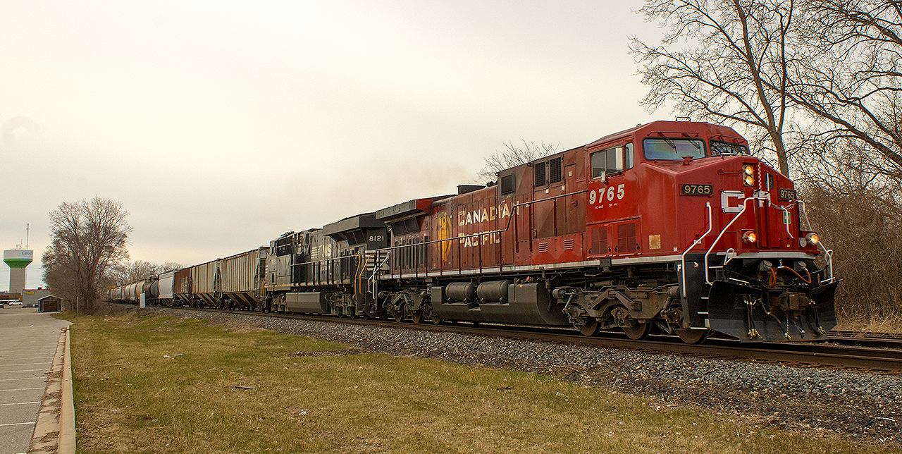 A wonderful spring evening is always a great backdrop for trains. Here, as the sun descends ending another day, CP 9765 and NS 8121 lead this eastbound through Chatham under  another golden sunset.