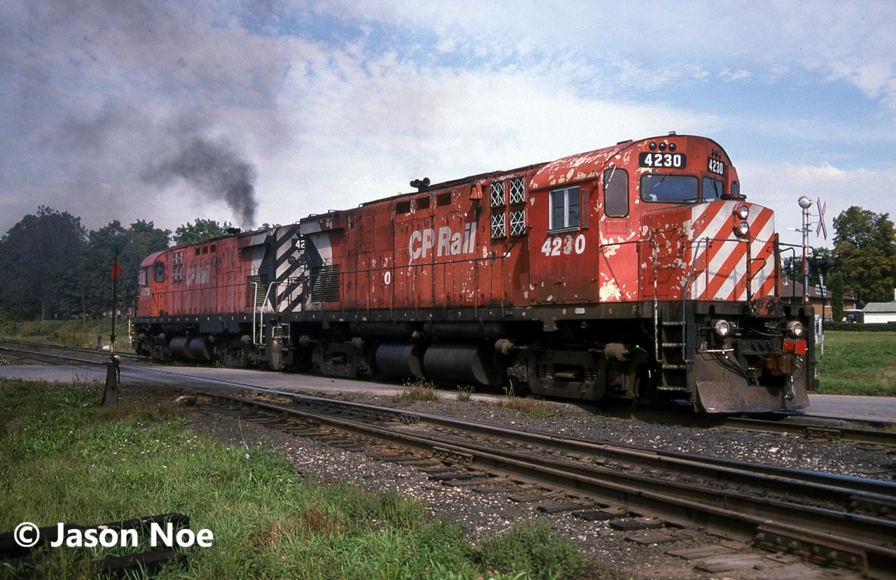 The CP London Pick-Up is viewed departing the yard at Woodstock, Ontario eastbound with C-424’s 4228 and 4230. The crew would take the siding at Coakley for a meet with a westbound before continuing on to Galt.