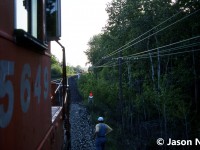 A view from CP SD40-2 5649 as train 737 waits at the west siding switch Puslinch for a meet with an approaching eastbound on the Galt Subdivision. At the time, 737 was a dedicated auto train and on this evening the friendly crew had invited a friend and I along for a cab ride to the top of Orrs Lake hill from Puslinch. The consist included SD40-2’s 5649 and 5682.