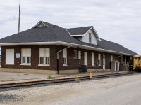 Any trip to the area, and I'll be checking on all rail activity. Having been in Sarnia for a special day with my daughter who was 2.5 yrs old at the time, we drove the family sedan into the industrial area near the end of Clifford Street to stop at the old C&O station.
<br>
<br>
When one does this, it is under very watchful eyes. This day was no different  however, I rolled down the window and spoke to a railway employee. He seemed baffled why I'd drive in here with a toddler, but gave permission with strict rules of keeping safe.
<br>
<br>
Needless to say, I never stepped out of the car. I angled it, and quickly snapped a couple of photos of the rear of this old building. Looking back, I wish I drove closer up to the two, flat roofed vans to have taken better photos. Upon my last trip back here this past summer, neither of these old relics were there, and the siding was removed.