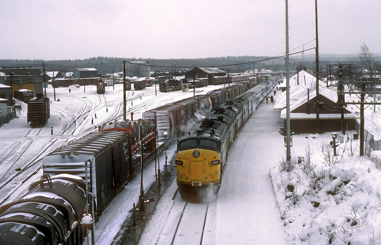 The westbound Canadian at the station by the Canadian Pacific yard in Chapleau.