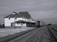 <b> Serene setting </b> <br>
The consist of VIA 692 The Hudson Bay is parked on the station track in Churchill this late September afternoon waiting for passengers to arrive for the journey to Winnipeg. <br>
In a few hours the station will open, and the platform will be busy with baggage vehicles, VIA staff, and anxious travelers.