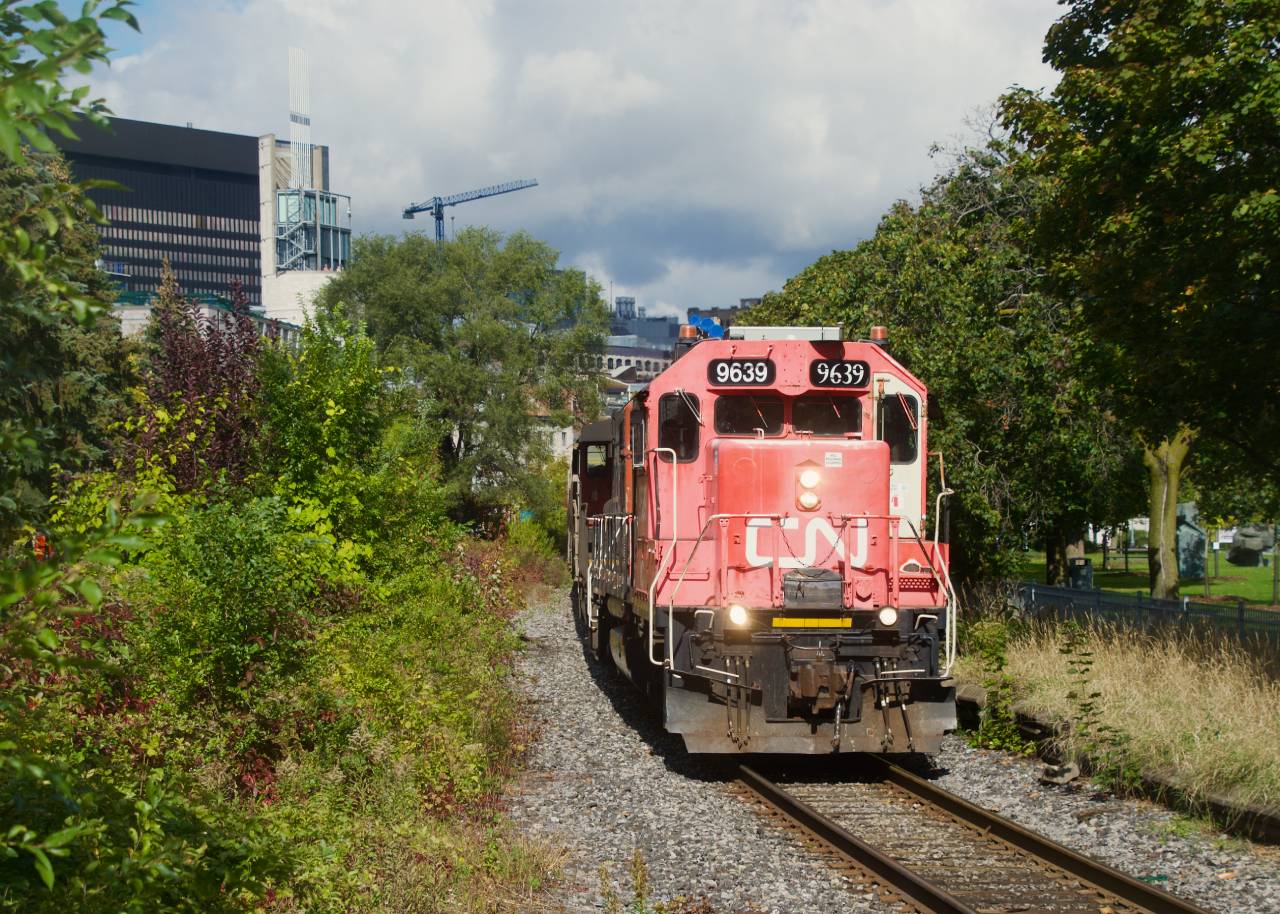 The sun cooperates as CN 500 leaves the Port of Montreal.