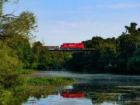 CPKC H86 barrels eastward over the Middle Thames River at Thamesford towards a meet with 231 at Zorra.