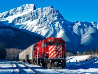 CP's Exshaw Switcher rests in the shadows of the Rocky Mountains, alongside the Laggan Sub awaiting a new crew to complete the return job of loads to Aylth Yard.