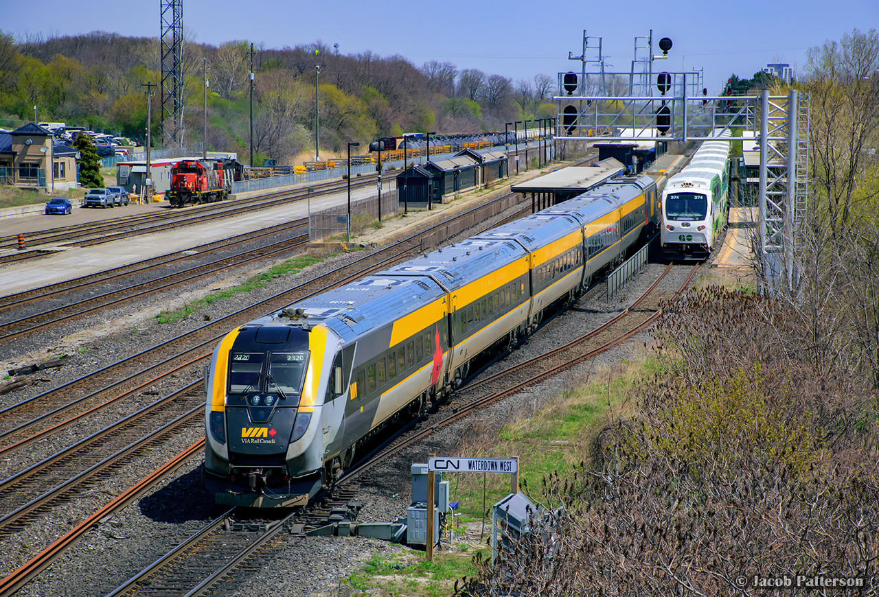 VIA 73 takes the light at Waterdown West departing Aldershot en route to Windsor.  At right, GO 1020 waits to depart for Toronto Union Station, while at left, CN L550 drills the yard with 4725 - 4138.