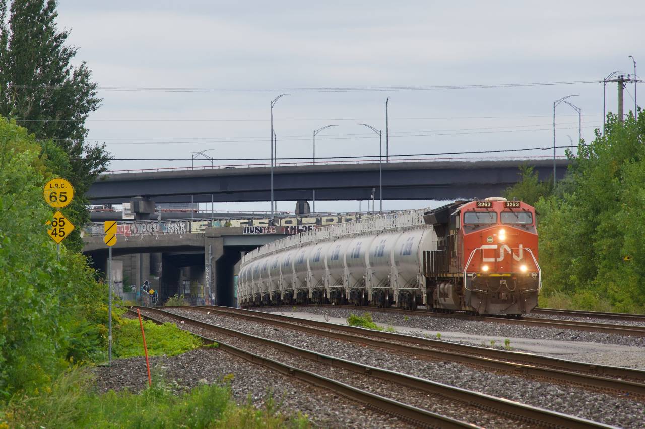 After refueling and getting a new crew, an empty TankTrain unit train heads east.