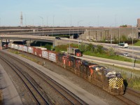 CN 401 is amply powered as it passes the Turcot Interchange close to sunset.
