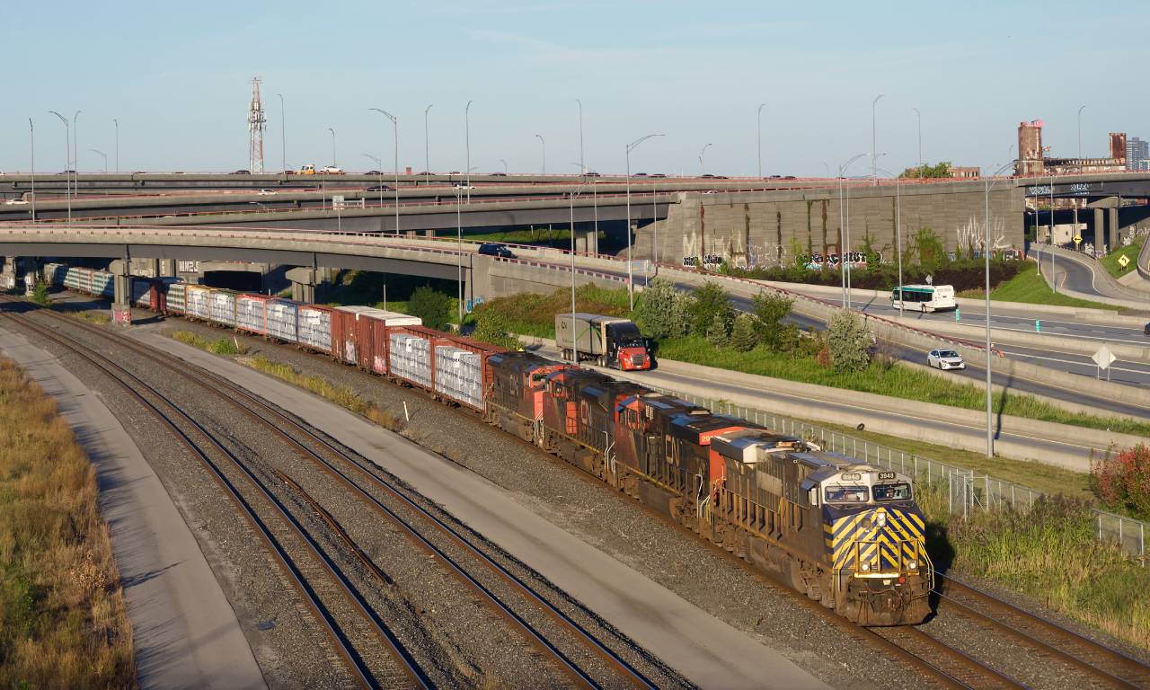 CN 401 is amply powered as it passes the Turcot Interchange close to sunset.