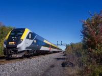 VIA 35 passes some fall colours as it prepares to make a stop at Coteau Station.