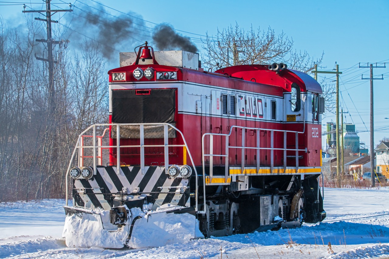 Greater Winnipeg Water District 202 is slowly backing their way into the yard after switching some cars around at the CN interchange.