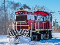 Greater Winnipeg Water District 202 is slowly backing their way into the yard after switching some cars around at the CN interchange.