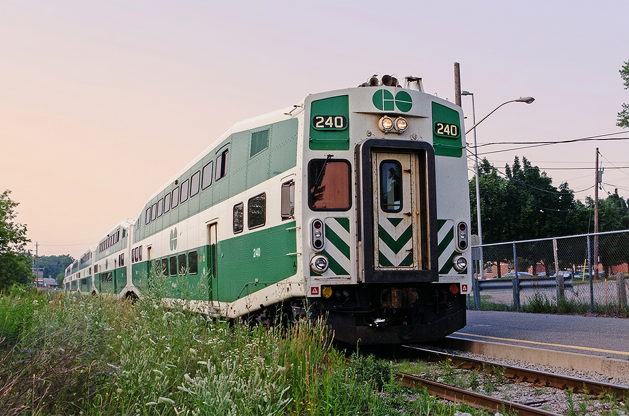 GO cab car #240 sit at Markham on a warm late August evening in 2001, ready to take a (very) light load of commuters down to Toronto Union Station and points in between. At the time, GO began modestly expanding service on the Stouffville line, with a morning and evening turn from Toronto Union Station to Markham and back, in passenger service both directions (no deadheading equipment moves). I took this opportunity to ride up and back on both the morning and evening runs a few times. The 10 minutes or so for the turn in Markham afforded the possibility of a few quick pictures. The 240 remains on GO's roster as of this posting, but the cab controls have been removed, and it is used as a mid-consist regular coach.