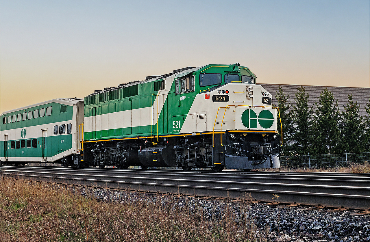 GO F59PH #521 pushes a westbound evening train full of commuters to a stop at Appleby. The 521 had recently been rebuilt and sports the short-lived and failed stylized "GO Transit" logo beneath the cab windows. The only other unit to wear this version of GO's logo beneath the cab windows was 520, and both were removed and replaced with the standard GO logo farther back in the white stripe shortly after this photo was taken. 527 was the one unique unit to wear this logo in a larger format on the sides of the locomotive. It only lasted a few months, reason being it was blurry and difficult to read. Very few photos exist of this logo on the motive power. Had I known it would shortly be phased out, I'd have pursued more opportunities to photograph these units.