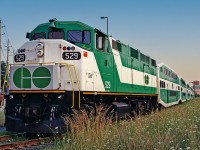 GO F59PH #529 idles at Markham on a warm August evening in 2001. At the time, GO began modestly expanding service on the Stouffville line, with a morning and evening turn from Toronto Union Station to Markham and back, in passenger service both directions (no deadheading equipment moves). I took this opportunity to ride up and back on both the morning and evening runs. The 10 minutes or so for the turn in Markham afforded the possibility of a few quick pictures. The 529 was unique in that it was the only F59PH to retain its original number boards after its midlife overhaul- for what reason, I do not know. This unit remains on the rails at the time of this posting, now owned by Amtrak/NCDOT hauling passengers between Charlotte and Raleigh, North Carolina (also my home State now).