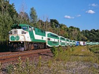 GO F59PH #547 rounds the bend by Kay Drage Park on the CP Hamilton Subdivision, on the way back to Willowbrook yard from Hamilton GO Centre with deadhead equipment.  During this time, all 3 daily GO trains to/from Hamiton GO Centre would deadhead from and to Willowbrook yard. Nowadays, there is a layover facility at the station, and these equipment moves are no longer necessary. The 547 was also among the last of GO's units to undergo an initial mid-life overhaul, and she certainly shows her external battle wounds in this picture.