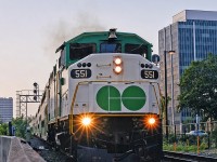 GO F59PH 551 throttles up out of Hamilton Go Centre on a muggy August 1998 morning. This was one of three weekday eastbound trains at the time operating from Hamilton to Toronto Union for rush hour. I took this photo with my Nikon F50 camera using a Nikkor 50mm lens and Kodak film- my main rig and preferred setup at the time.