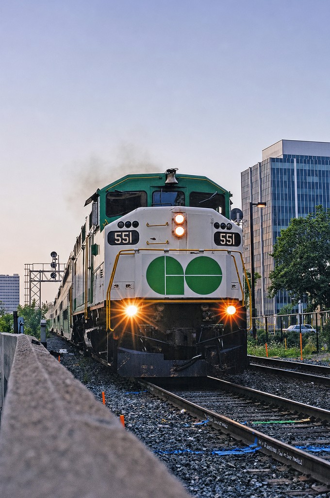 GO F59PH 551 throttles up out of Hamilton Go Centre on a muggy August 1998 morning. This was one of three weekday eastbound trains at the time operating from Hamilton to Toronto Union for rush hour. I took this photo with my Nikon F50 camera using a Nikkor 50mm lens and Kodak film- my main rig and preferred setup at the time.