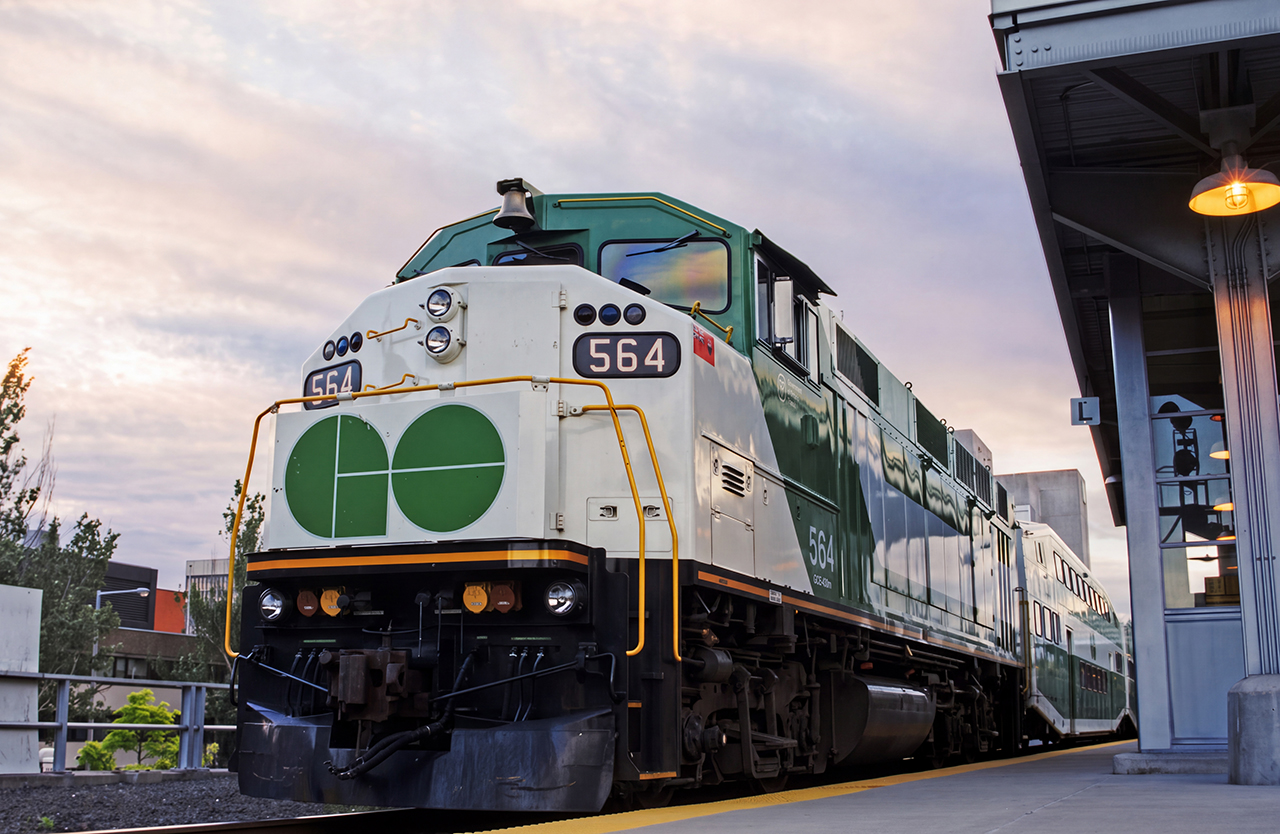 GO F59PH 564 (my favorite locomotive and handle here) idles at Hamilton Go Centre on a muggy August 1998 morning. This would be the third of three weekday eastbound trains operating from Hamilton to Toronto Union for rush hour, and the 564 was still in its original factory paint sporting the original number board until its first overhaul a few years later. I took this photo with my Nikon F50 camera using a Nikkor 50mm lens and Kodak film- my main rig and preferred set up at the time.
