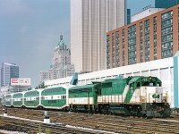 GO GP40-2M #725 leads F7 APU #802 and a long string of bilevels with another GP40 on the west end out of Toronto Union Station. Photo from my collection- a print I purchased at the Toronto train show years ago. Original photographer is Dave Shaw, per written info on rear of print.