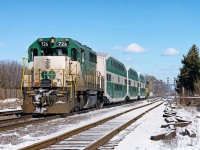 GO GP40-2M #726 shoves an eastbound mid-day Lakeshore West service towards Port Credit, Toronto Union Station and points east to Pickering. GO trains were often much shorter- and to me, more interesting- back then. Scan of a print I purchased at the Toronto train show in the early '90s.