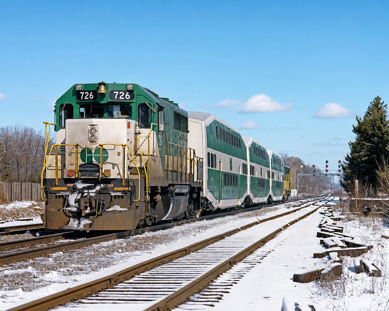 GO GP40-2M #726 shoves an eastbound mid-day Lakeshore West service towards Port Credit, Toronto Union Station and points east to Pickering. GO trains were often much shorter- and to me, more interesting- back then. Scan of a print I purchased at the Toronto train show in the early '90s.